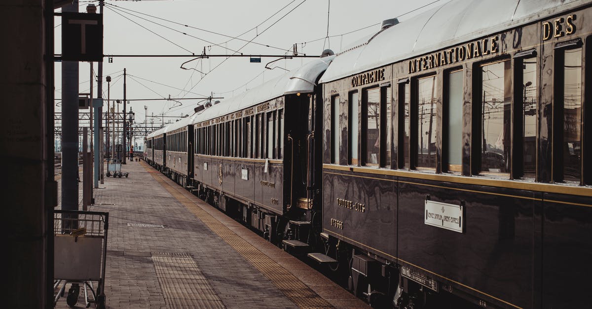 Does the Sealdah-Puri Duronto Express train have regular sleeper coaches? - Shiny black aged historical train parked on platform of railway station on sunny day