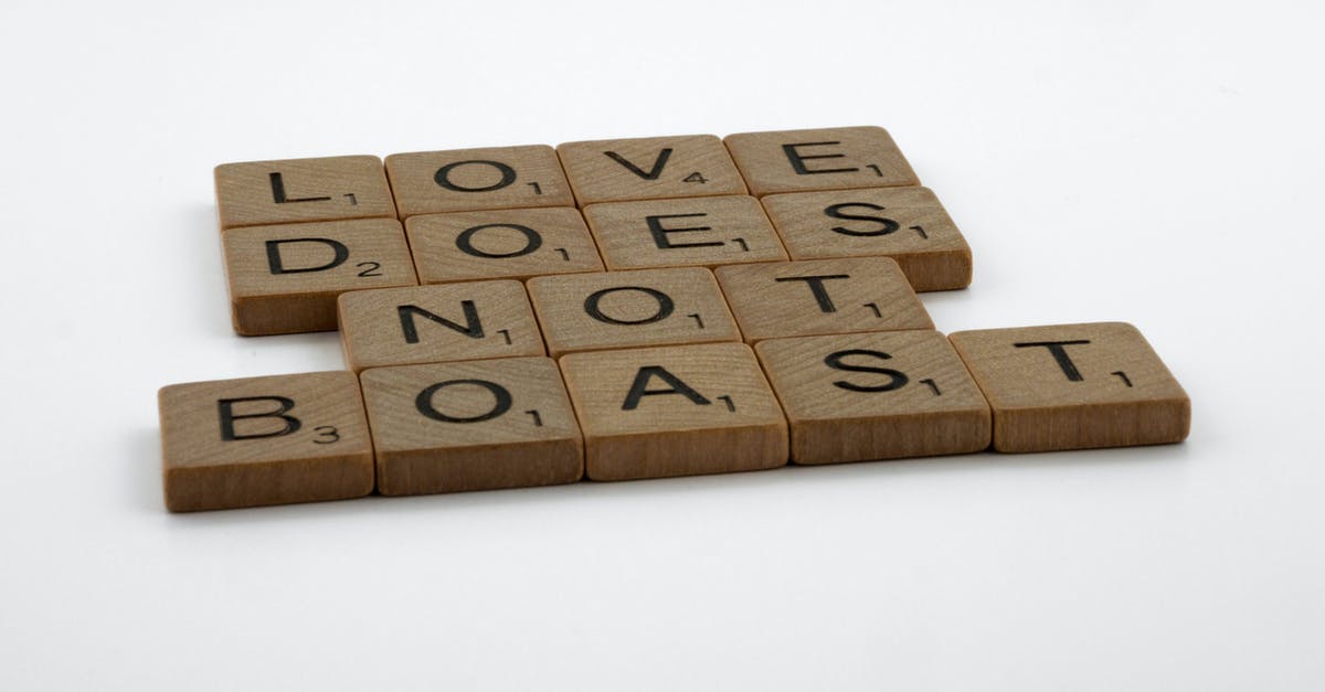 Does this count as "Sea kayaking"? - Close-Up Shot of Scrabble Tiles on a White Surface