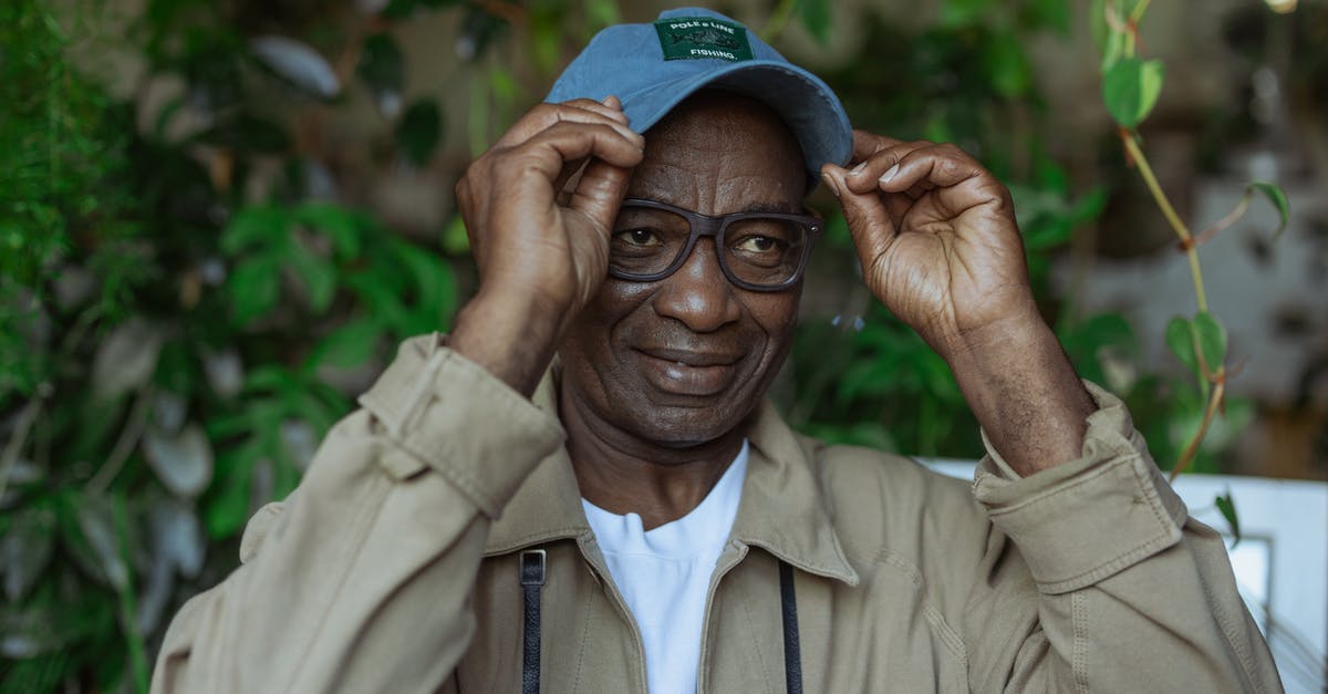 Does Tokyo Disneyland appeal to adults? [closed] - Photo of an Old Man Holding his Cap