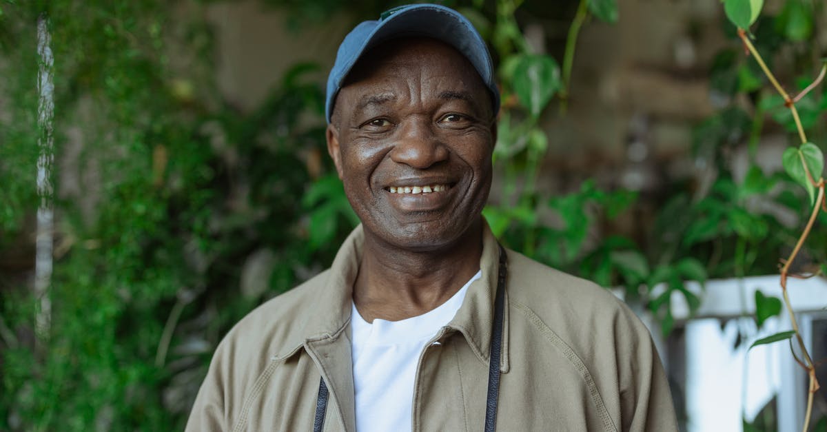 Does Tokyo Disneyland appeal to adults? [closed] - Photo of Old Man Wearing Blue Baseball Cap