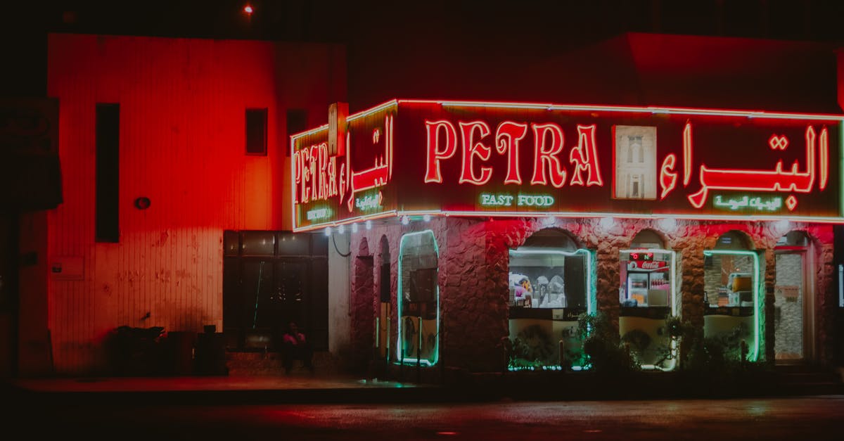 Doha layover at night - Red and White Unks Bar Store