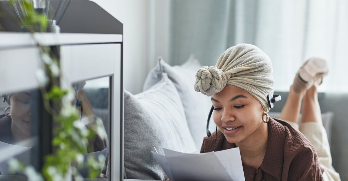 Domestic Or International Check In - Content black woman with headset reading documents