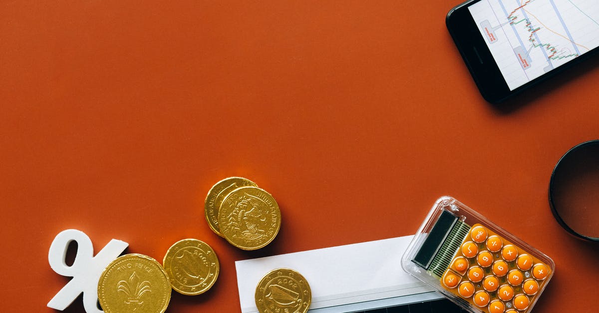 Donating unwanted foreign coins in Sydney - Gold Round Coins on Brown Wooden Table