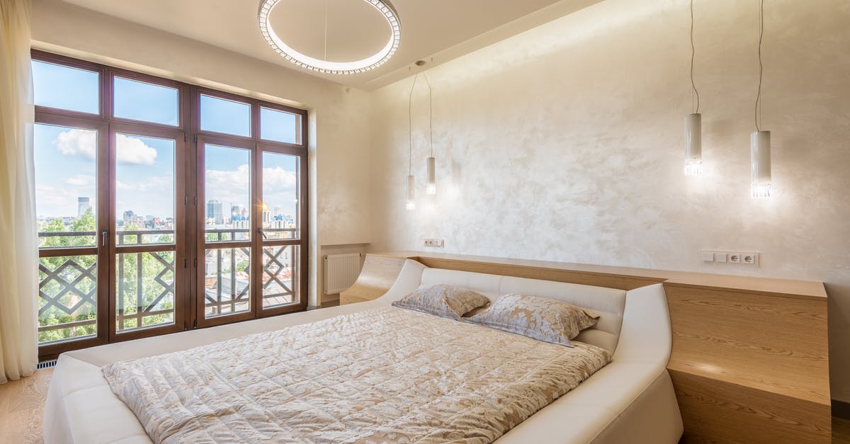 Double bed in Germany - Trendy light bedroom with balcony