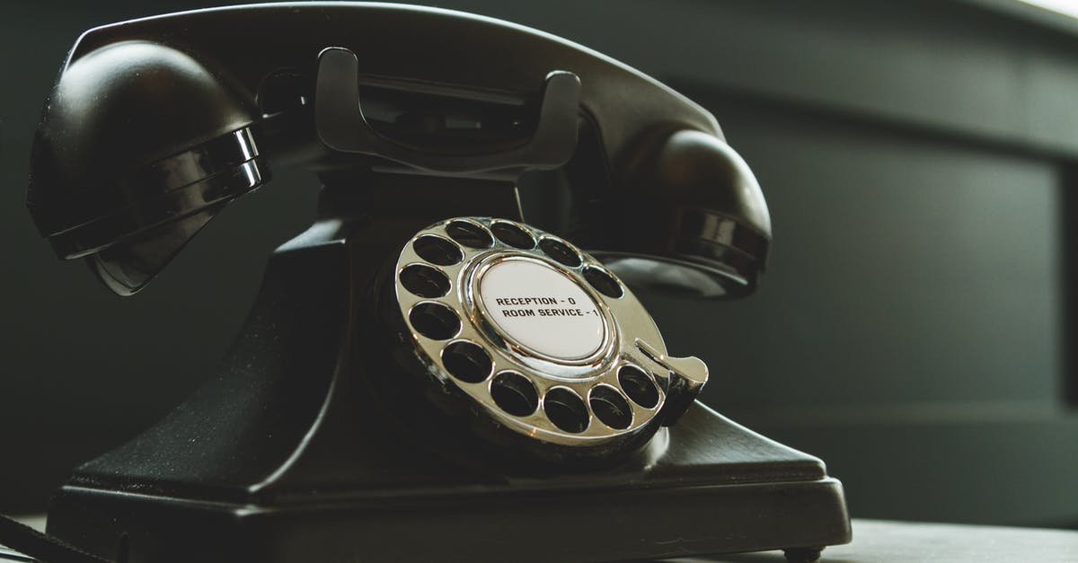 Doubt Regarding cancellation of hotel in hostelworld.com [closed] - Black Rotary Telephone on White Surface