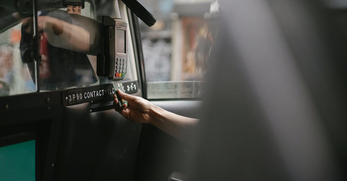 Drive a car or use CTA in Chicago? [closed] - Passenger using credit card for paying taxi ride