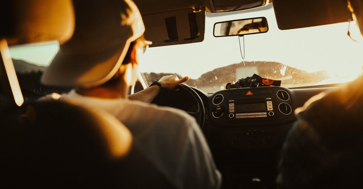 Driving 12 passenger van in UK - Man Holding the Steering Wheel While Driving