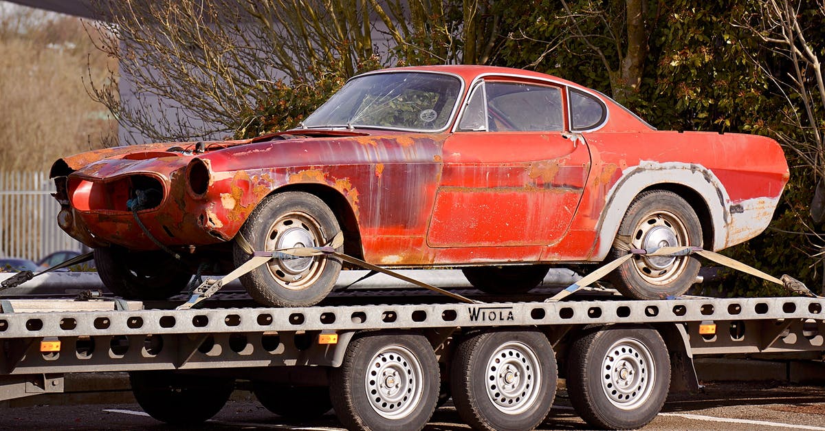 Driving a 21 foot tow truck flat bed [duplicate] - Red Coupe on Flatbed Trailer