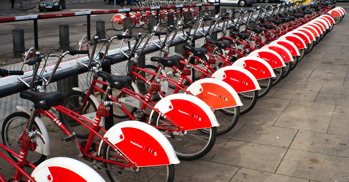 Driving a rental car through Colorado - Parked Red and White Bicycles