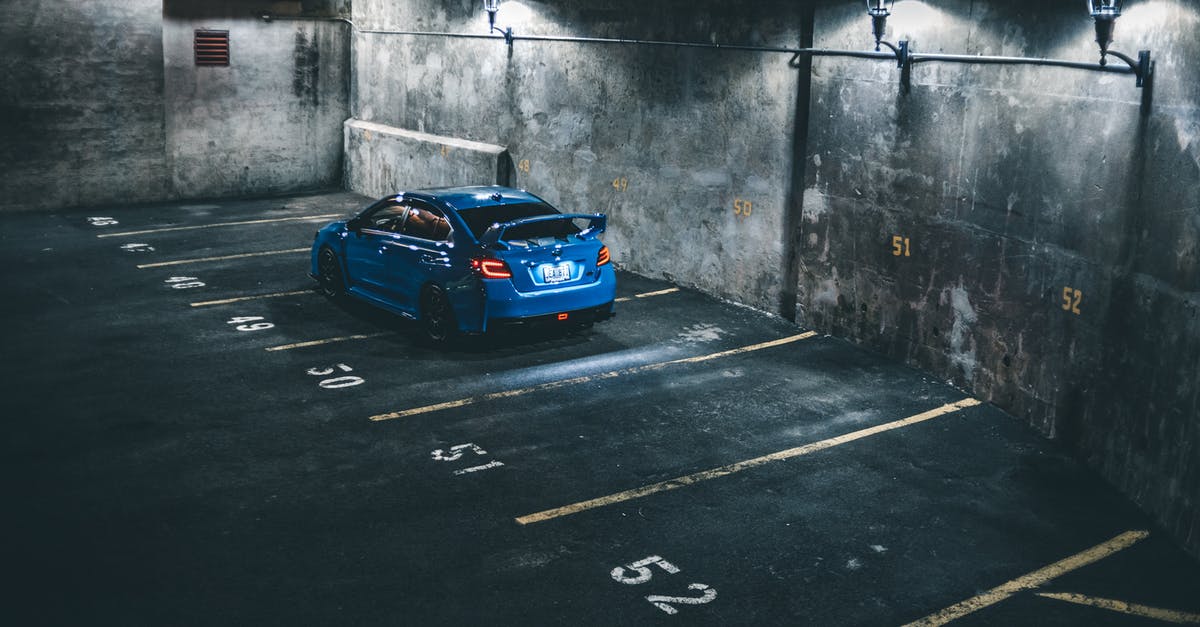 Driving Someone Else's Car Across US/Canada Borders - Blue car on parking lot