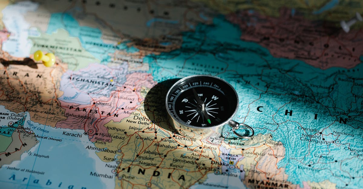 DS-160- Countries visited after filing DS160 [closed] - Compass Placed on a World Map