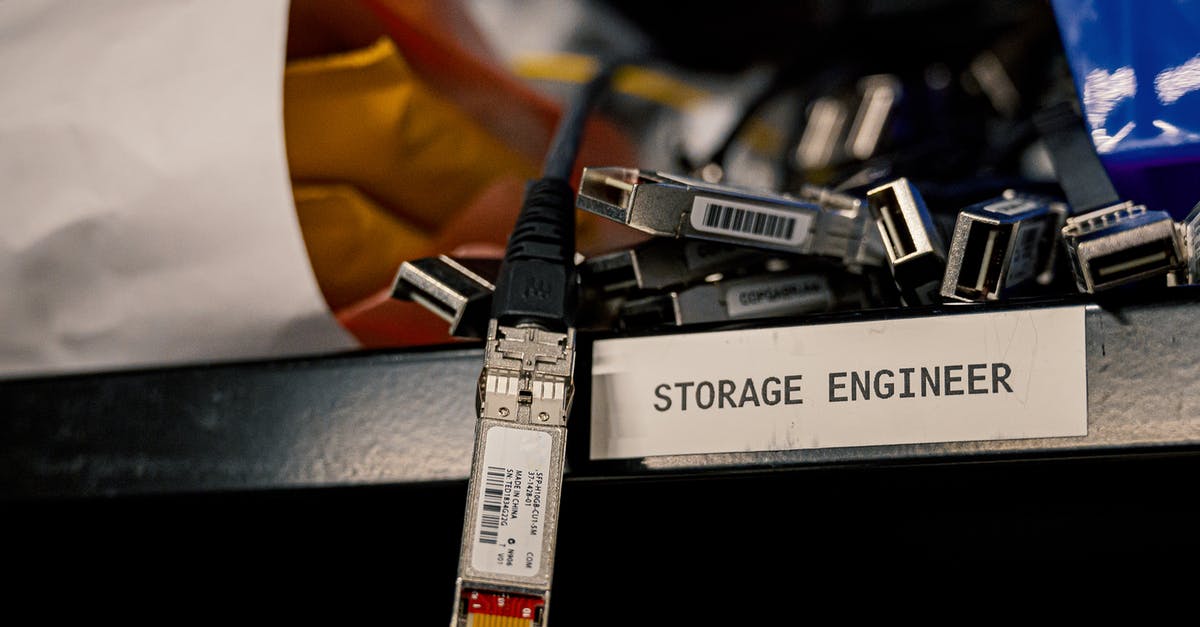 DS-160 Security and Background Information for UK Banned Applicants - Low angle of various connectors and USB cables placed on shelf with storage engineer inscription