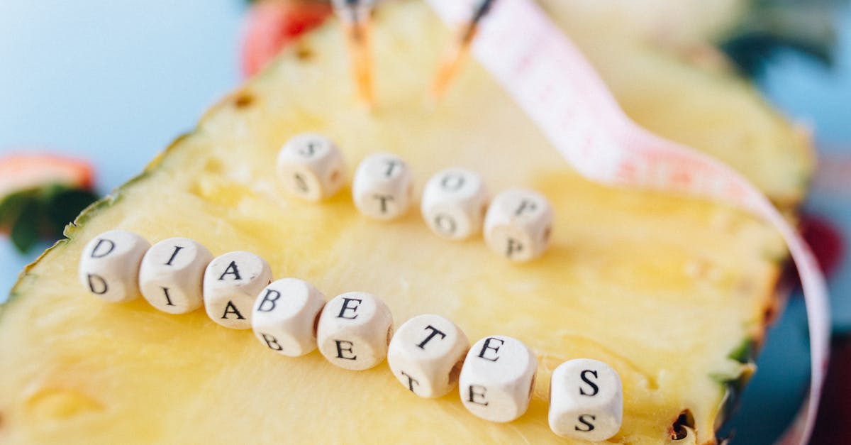 Dual citizenship causes confusion at passport control - Letter Dices over a Cut Pineapple Fruit