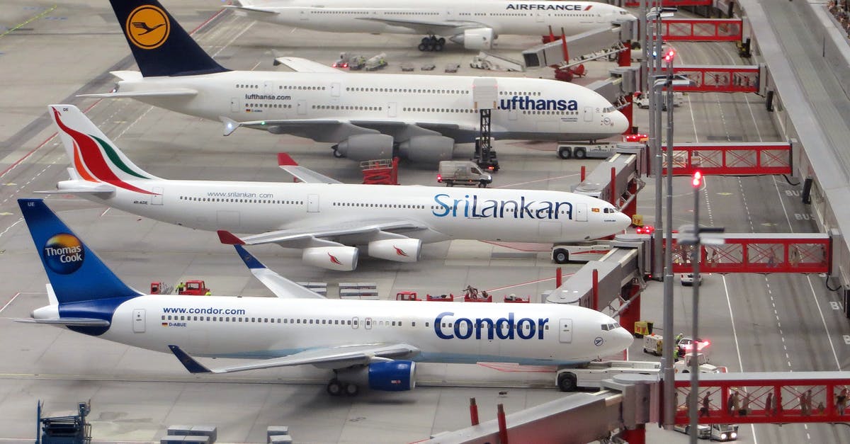 Dubai Airport changing terminals - Condor Airplane on Grey Concrete Airport