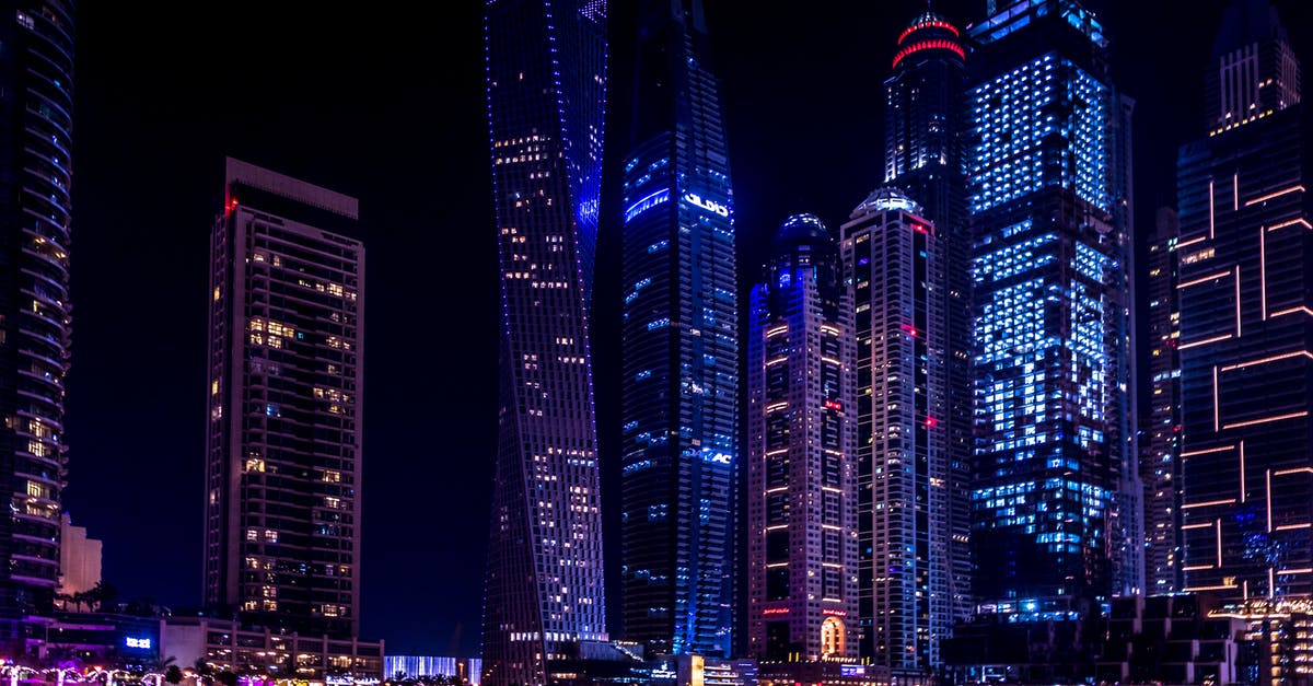 dubai at night with layover [closed] - Twisted Building during Nighttime