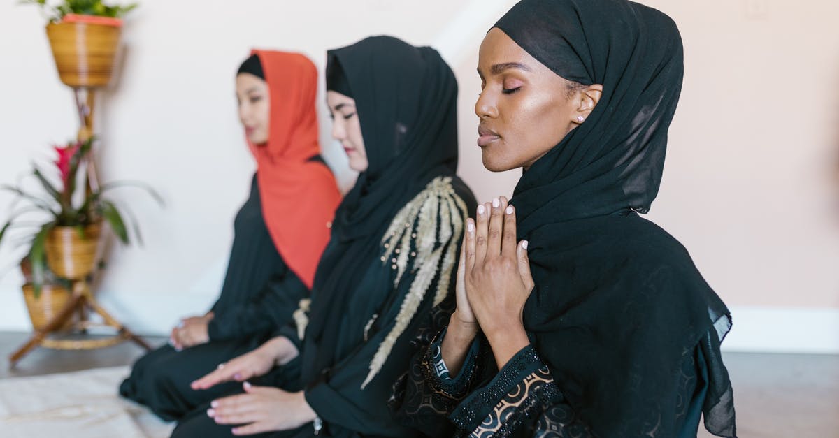 Dubai Terminal 3 - Women in Black Hijab Praying