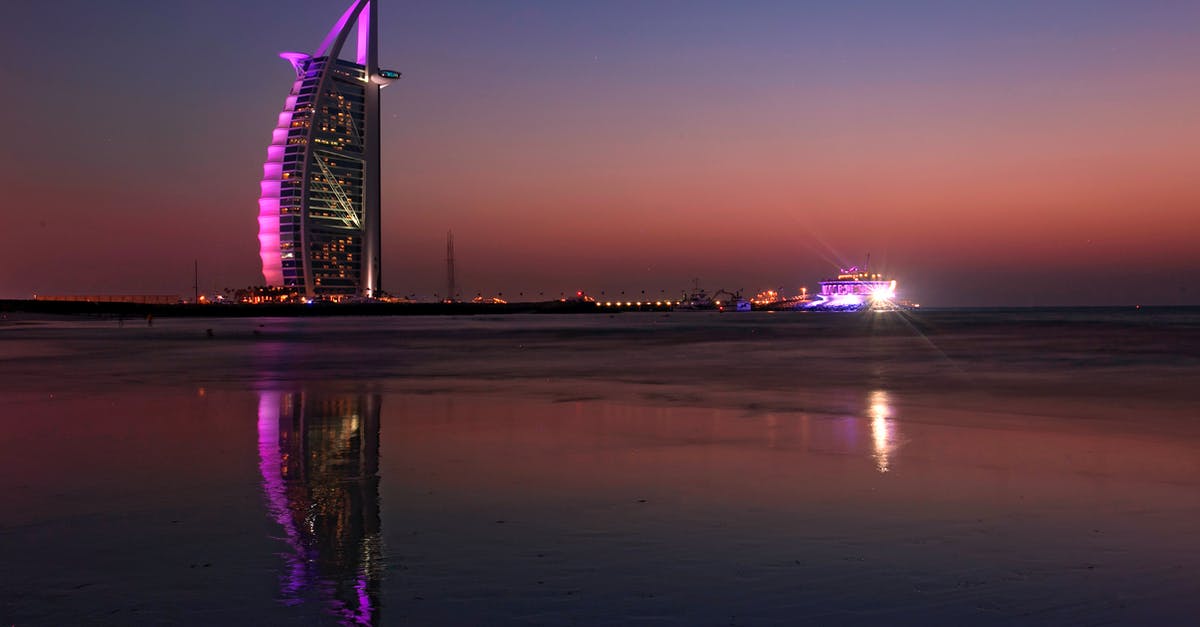 Dubai Terminal 3 - Sydney Opera House Near Body of Water during Night Time