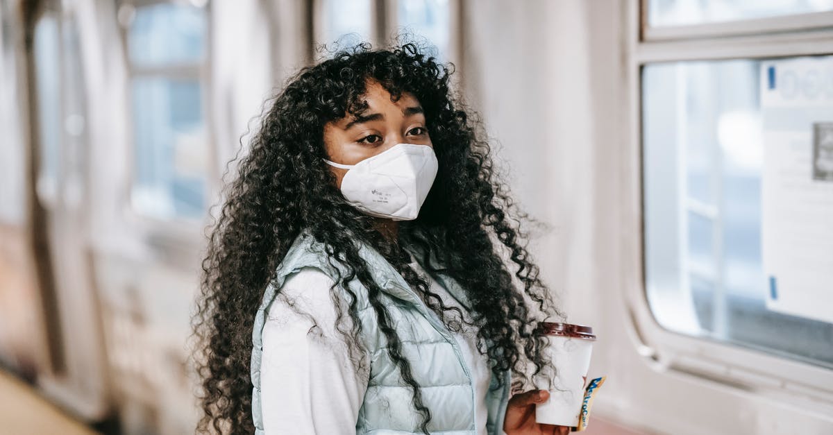 Dublin Transit visa for Sri Lankan citizens - Black woman in mask waiting to enter subway train