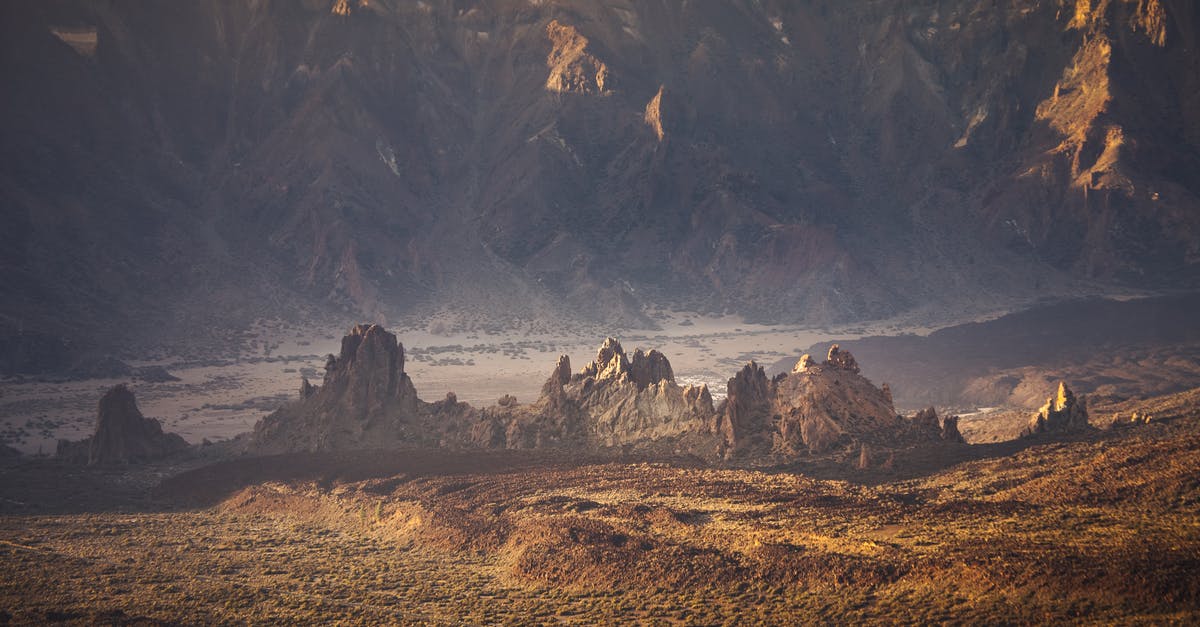 Early morning on-demand taxi in Barcelona, Spain - Brown and Black Rock Formation