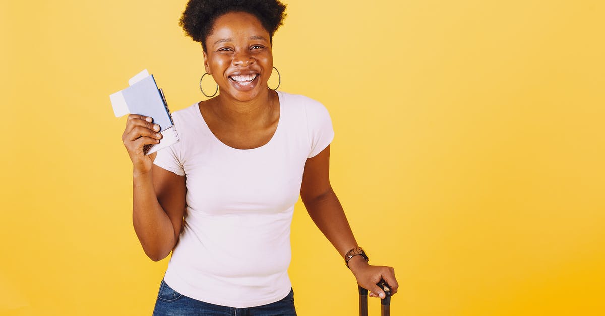 Easier to travel on a Swiss passport than American? - Smiling Woman in White Shirt Holding Her Passport