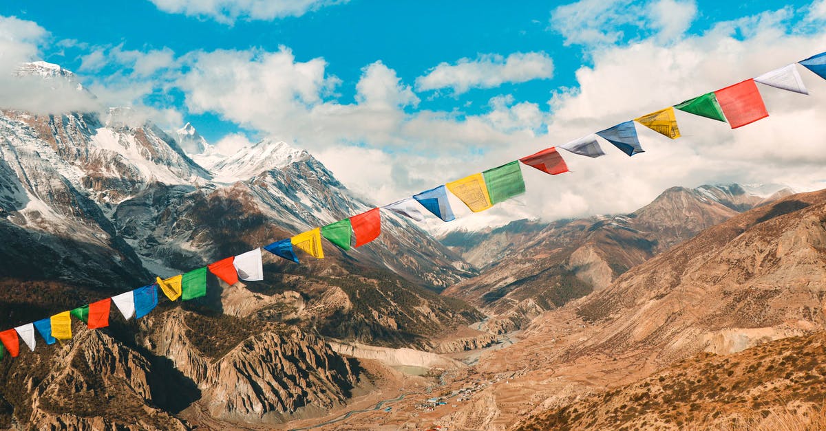 Easily accessible snow in Nepal - Colorful Flags on String in Mountains