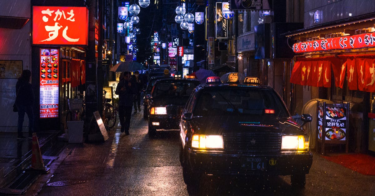 Eating while out on a public street in Japan - Photo of Cars in the Street