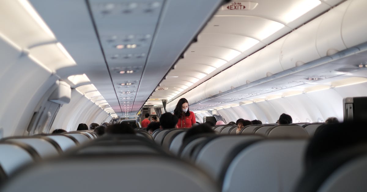 EC261 compensation for wrongful denied boarding - does the handling agent or the airline pay? - People Sitting on an Airplane Seats