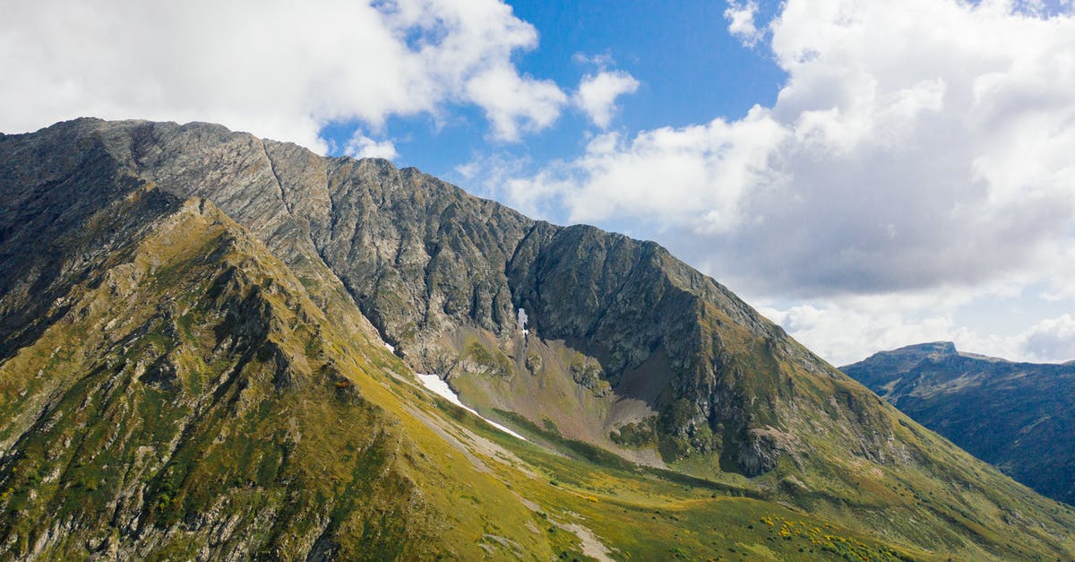 Ecuadorian traveling to Sochi via Heathrow - Photo of Mountain Under Cloudy Sky