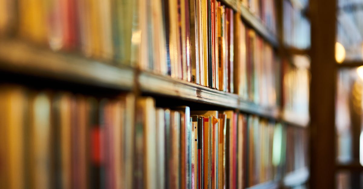 Education history in DS160 - Selective Focus Photography of Brown Wooden Book Shelf