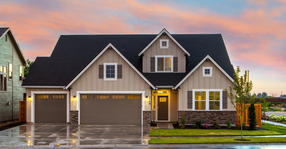 EEA family member with 2 valid residence cards - Brown and Gray Painted House in Front of Road