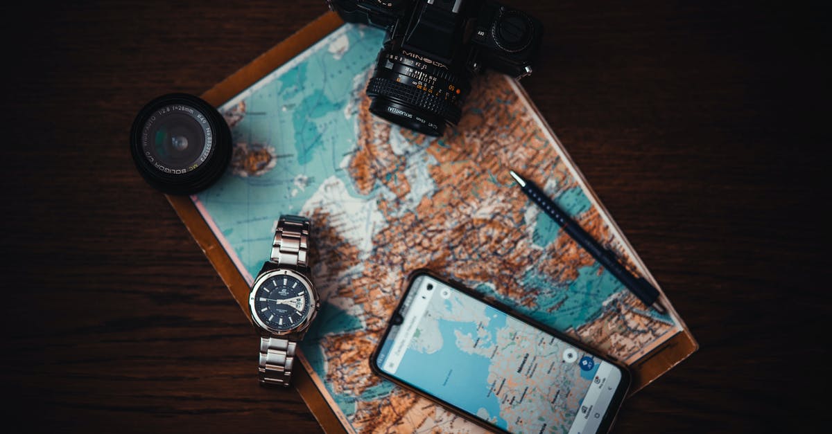 Electronic Map with Lodging pricing - Smartphone Beside Watch and Camera