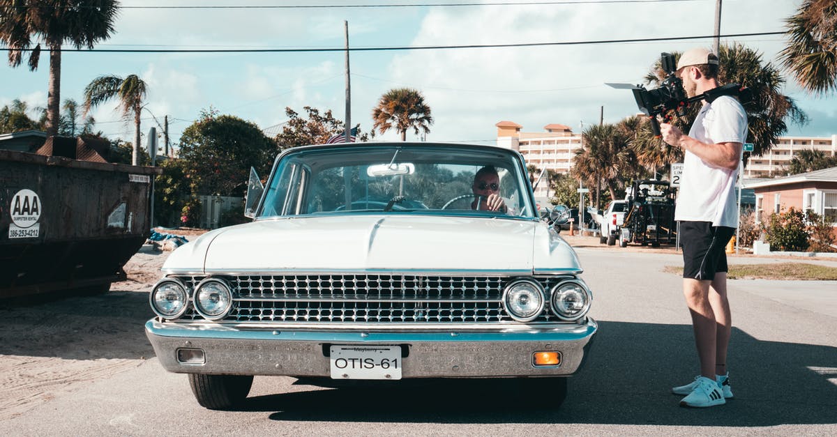 Electronic road tolls (cashless) in Florida - Man Beside Car