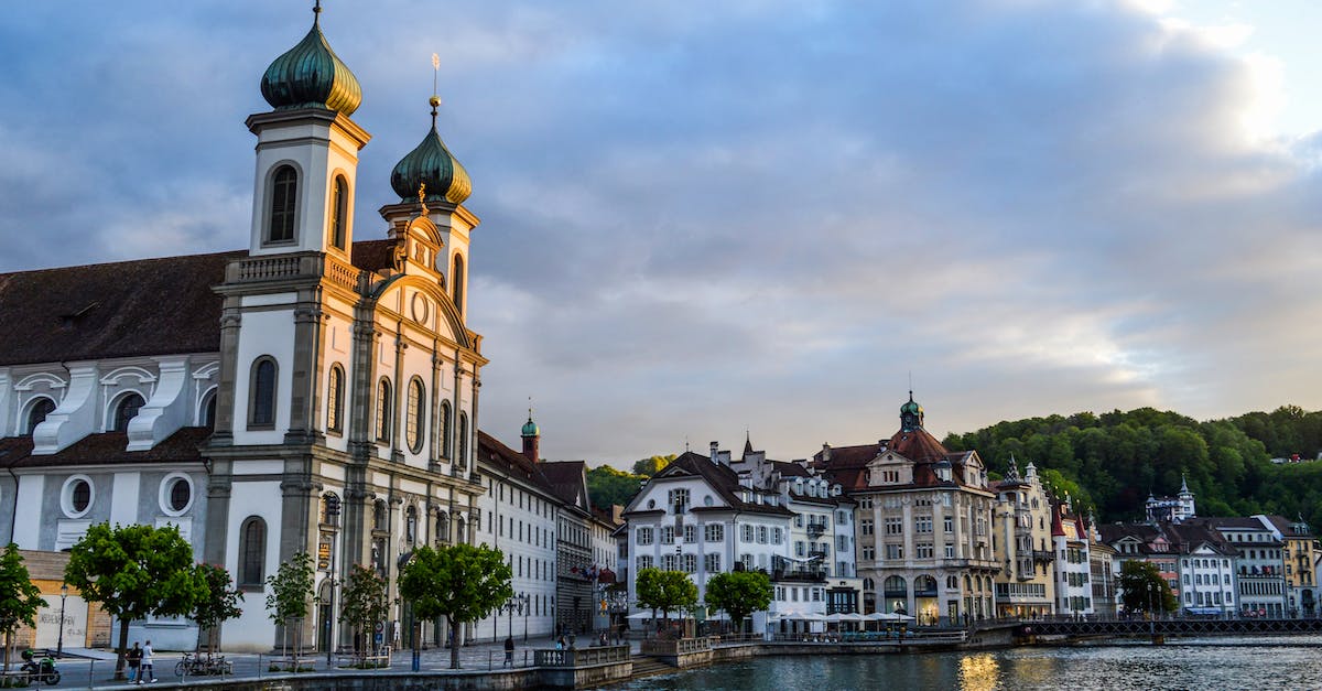 Elm, Switzerland - Suvorov monument and Glarus thrust - Facade of medieval Baroque church on town seafront