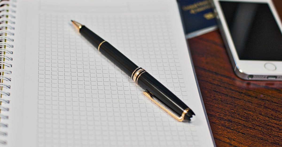 Embassy stamped the last (empty) page of the passport - Black Click Pen on Spring Notebook