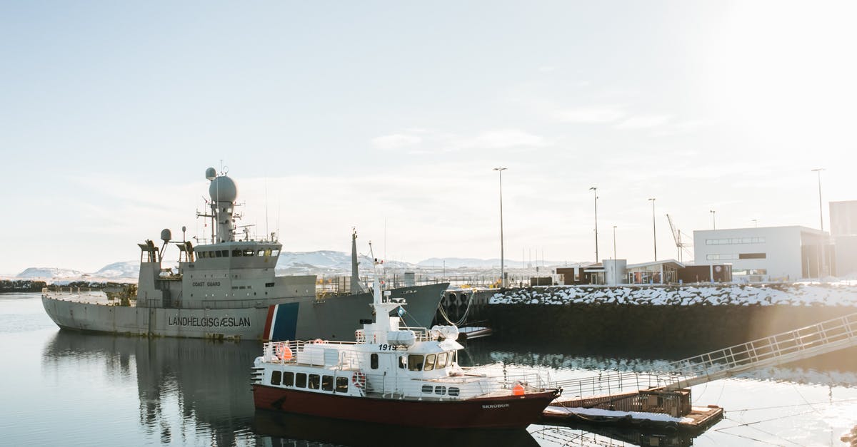 Emotive Sculpture in a Port - Where Is It? - Red and White Ship on Dock