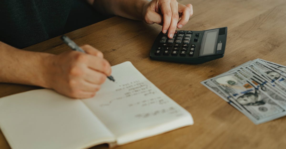 Enough money for Italy tour? [closed] - Person Writing on White Paper Beside Black Desk Calculator