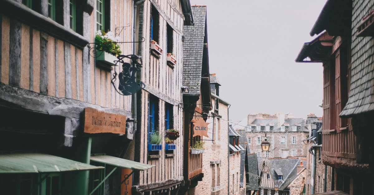 Entering Germany before granting of residence permit [closed] - Narrow street with old authentic buildings