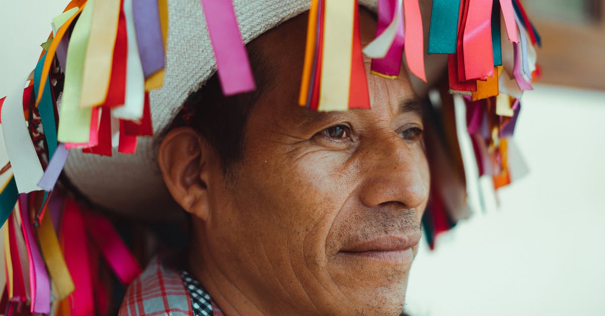 Entering Mexico and re-entering the USA with visitors visa - Close-Up Photo Of Man Wearing Traditional Hat