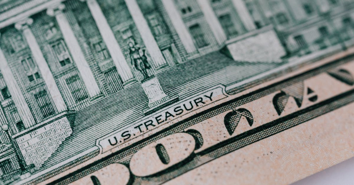 Entering the United States on a return ticket from Mexico under the VWP - Dollar banknote on white table Entering the United States on a return ticket from Mexico under the VWP - Dollar banknote on white table