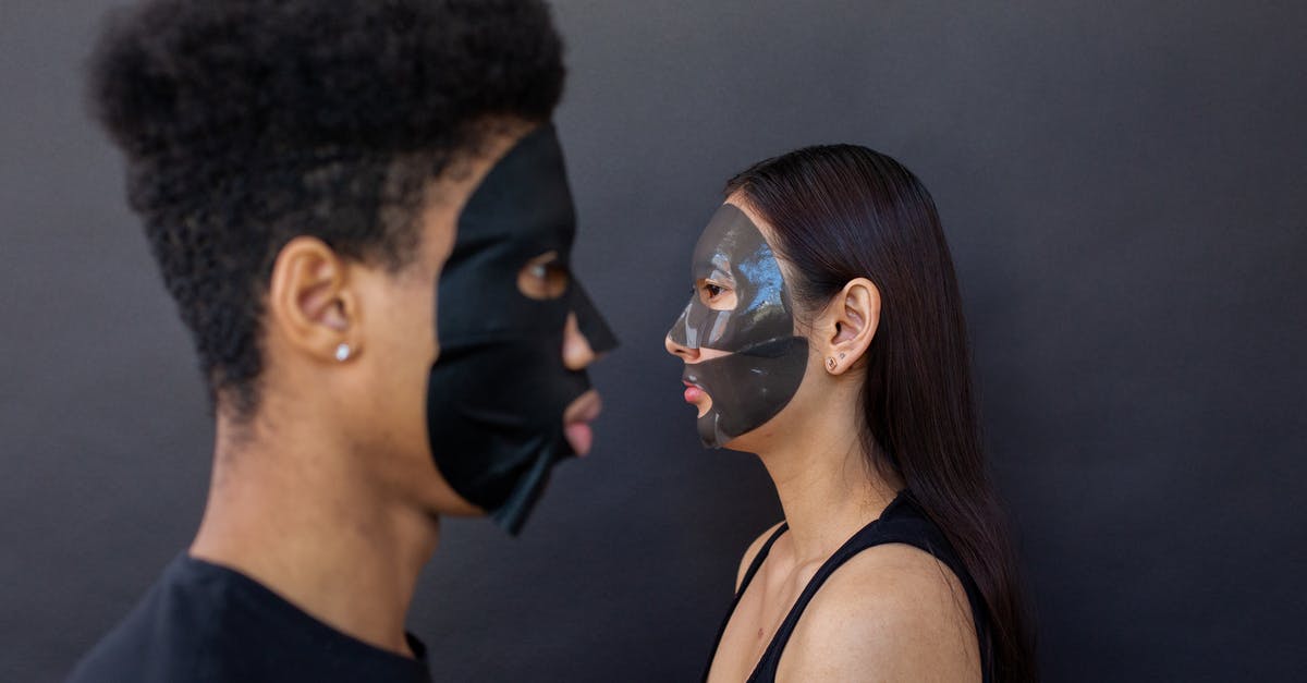 Entry procedure to Korea (long term stay?) [closed] - Side view of multiethnic couple in sheet masks for cleansing beauty procedure against black background