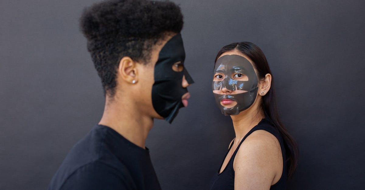 Entry procedure to Korea (long term stay?) [closed] - Side view of ethnic girlfriend in cleansing mask near African American boyfriend against black background