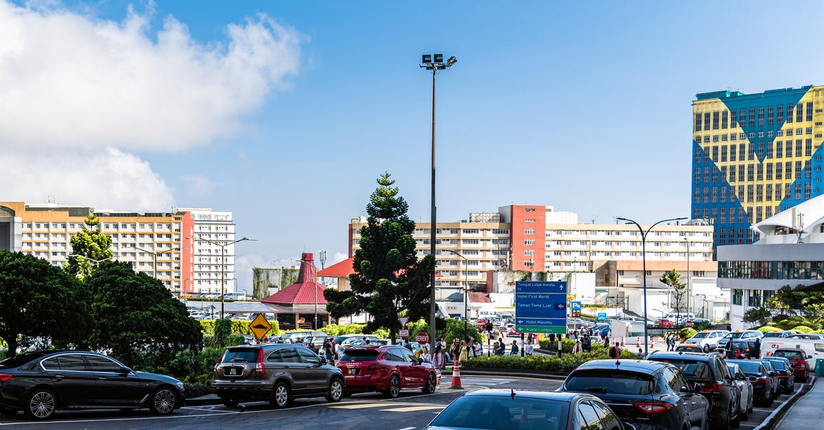 Entry to Malaysia - Cars Parked on Parking Lot