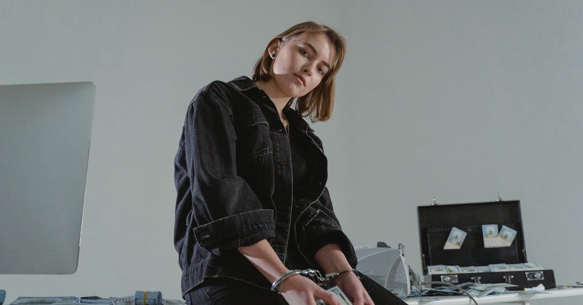 Entry to U.S with criminal record - A Woman Sitting on the Table