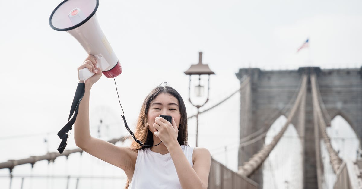 Entry to USA after previous denial - Woman in White Tank Top Holding White Ceramic Mug