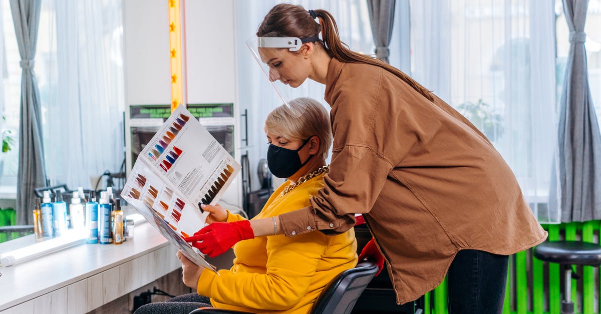 ESTA denied, visit visa still in process - Female hairdresser working with client during pandemic