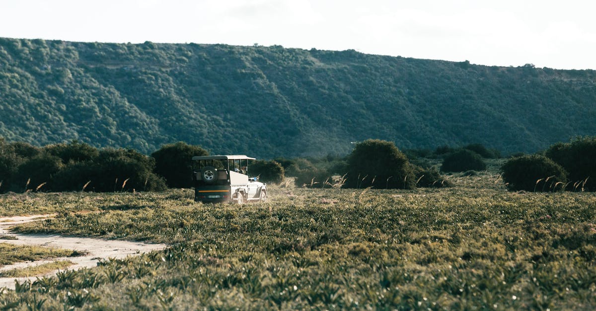 ESTA: Do I need to tell all my trip itinerary? - ATV driving on road against green mountain in savanna