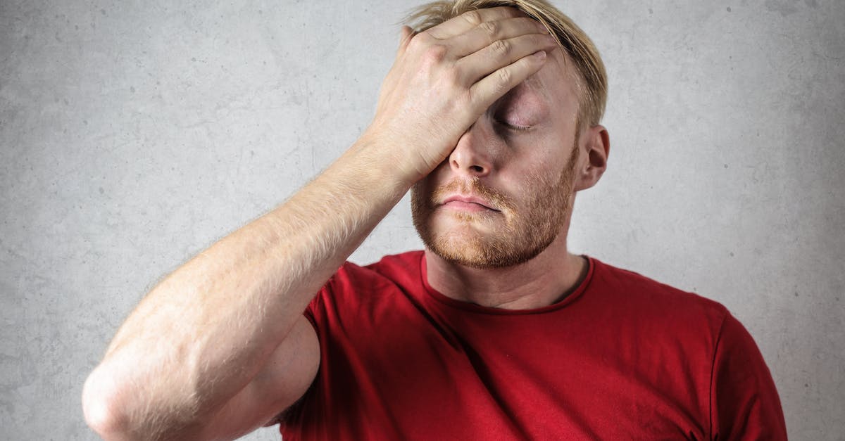 ESTA, first name confusion - A Man in Red Shirt Covering His Face 