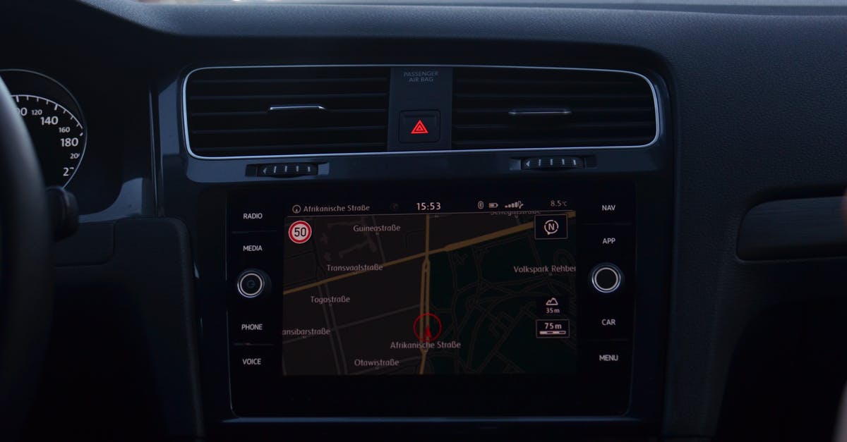 ESTA form: Mention the city district in the contact information section? - Interior of modern car with steering wheel and navigation system showing route through city streets