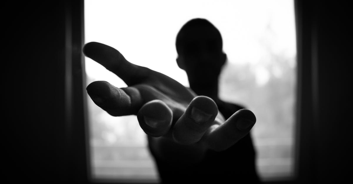 ESTA help please! [duplicate] - Man's Hand in Shallow Focus and Grayscale Photography