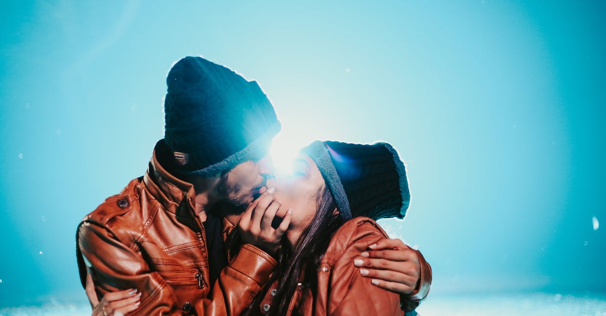 Ethiopian Airlines tickets seem to always have the same price regardless of the proximity of the date? - Ethnic couple in same clothes cuddling and kissing near snow under bright blue sky in sunny weather in back lit